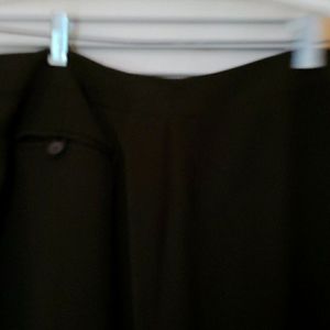 Super cute skirt with back buttoned pocket. Rich B